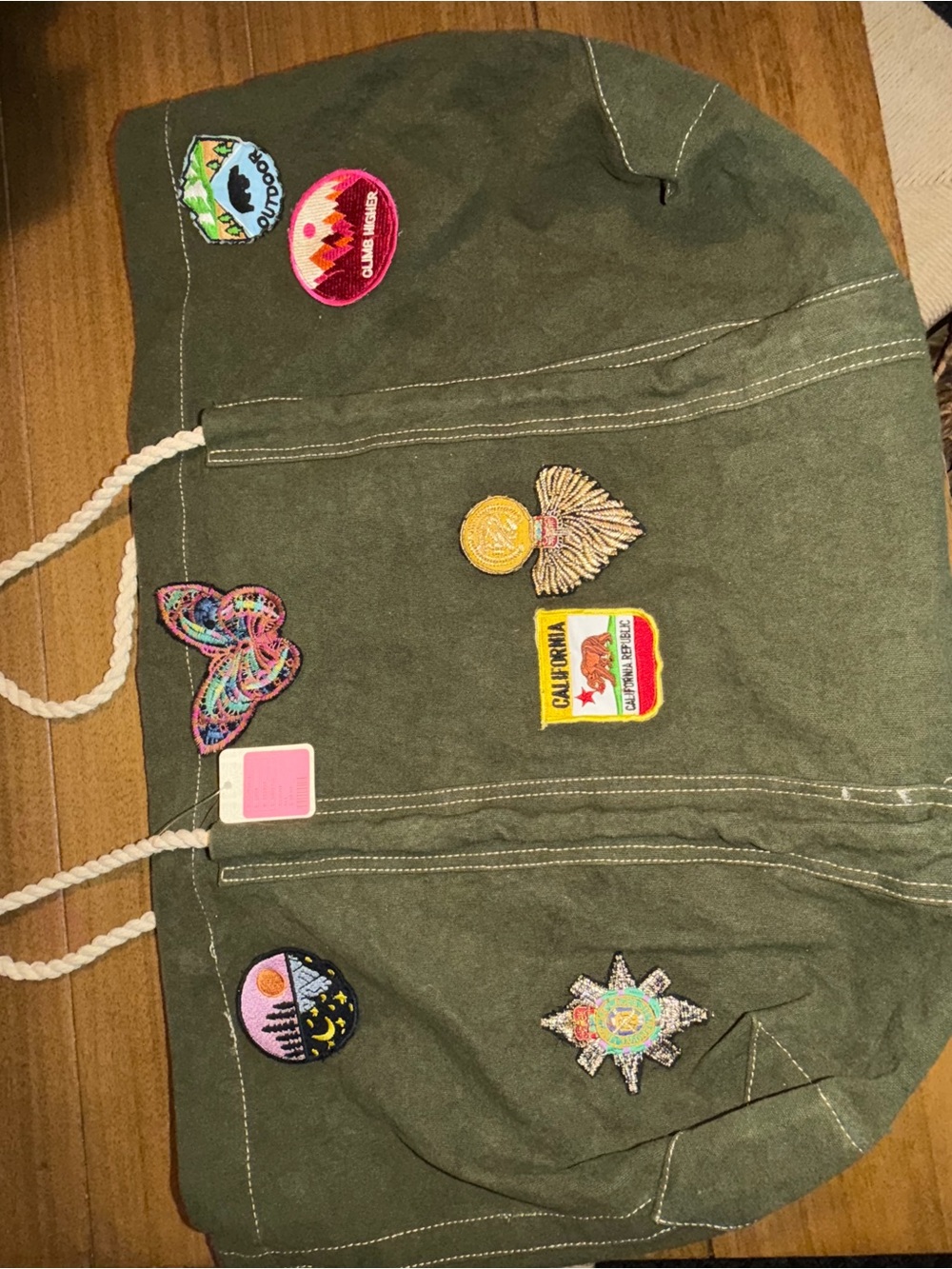 NWT Free PeopleOlive Green travel bag with Embroidered Patches